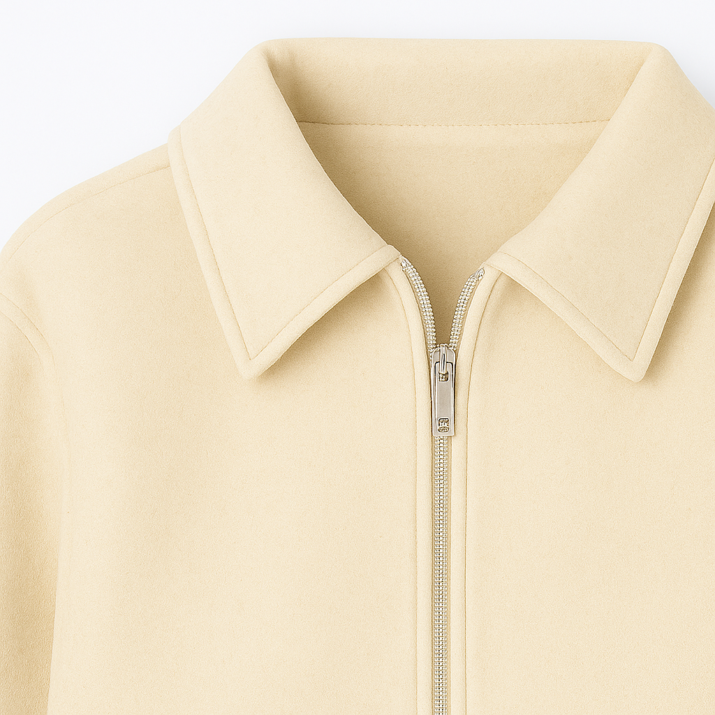 Zip-up jacket with classic collar, long sleeves, and side welt pockets.