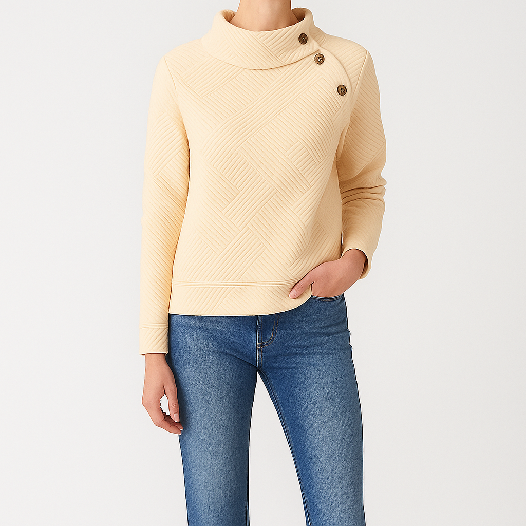 Textured pullover with high buttoned collar and quilted geometric pattern.