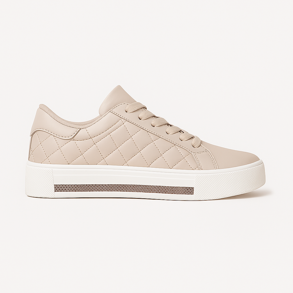Low-top sneaker with quilted side panels, lace-up closure, and thick rubber sole.