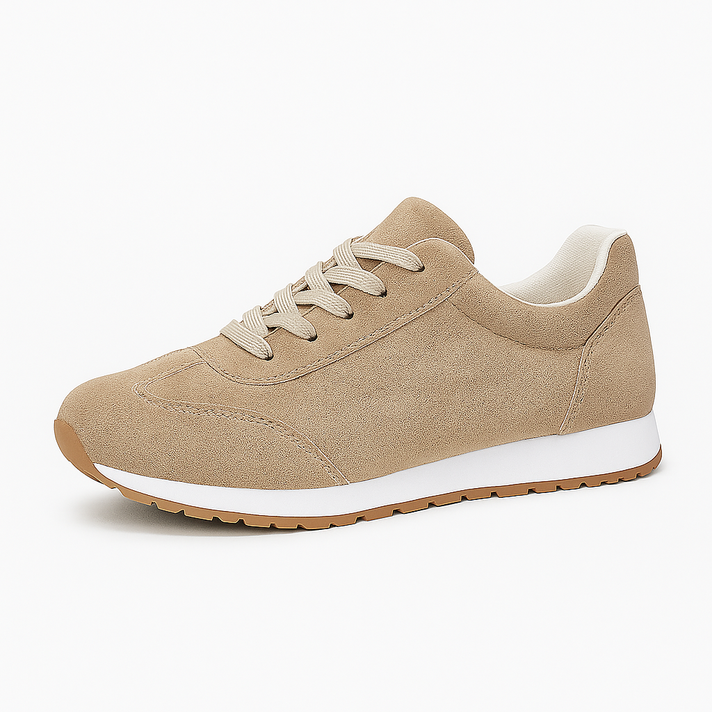 Low-top sneaker with lace-up closure, cushioned collar, and textured rubber sole.